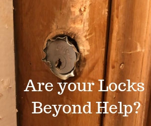 Old broken lock in wooden door